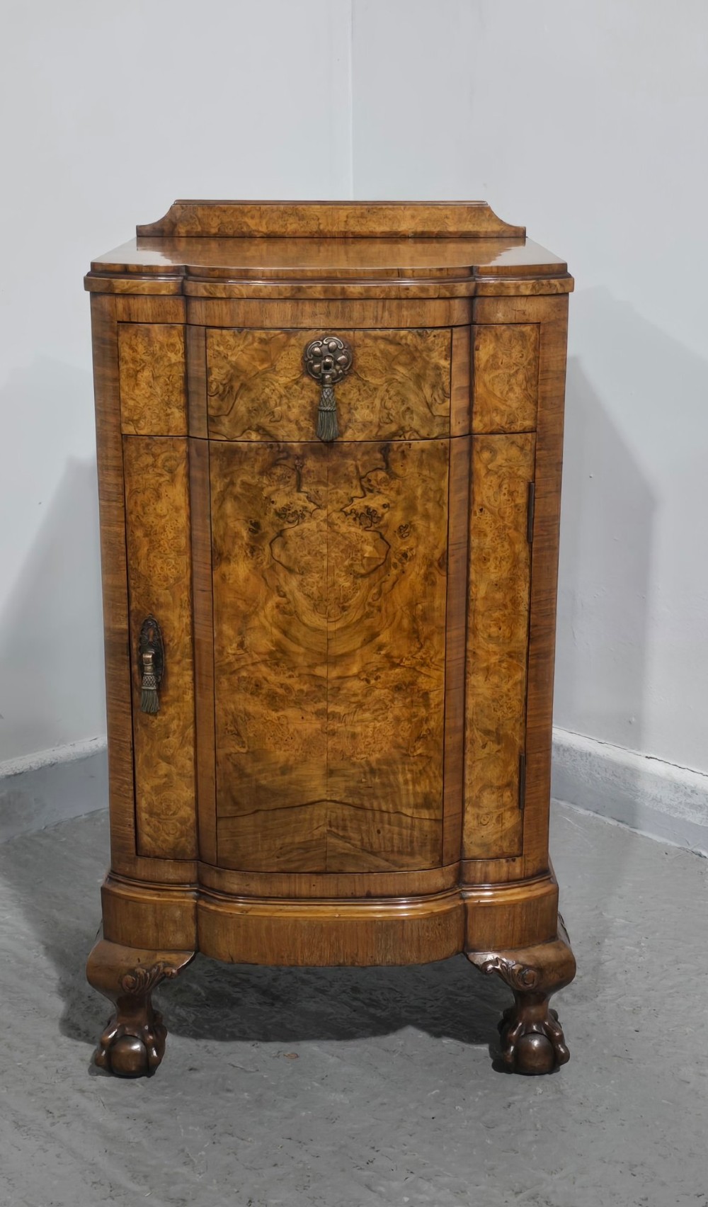 A small burr walnut side cabinet with a single upper drawer over a cupboard door, raised on carved cabriole legs with claw-and-ball feet. View II