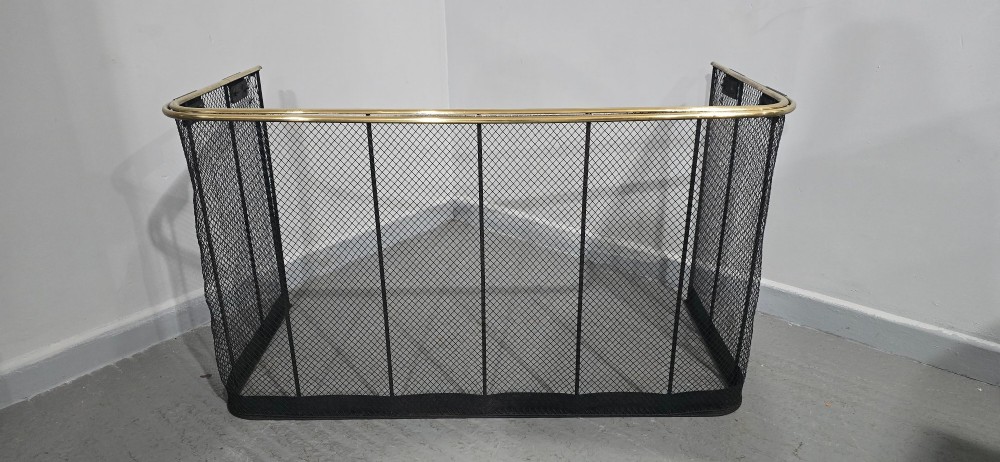 A three-sided black wire mesh fireguard featuring a polished brass rounded top rail and a solid base. View III