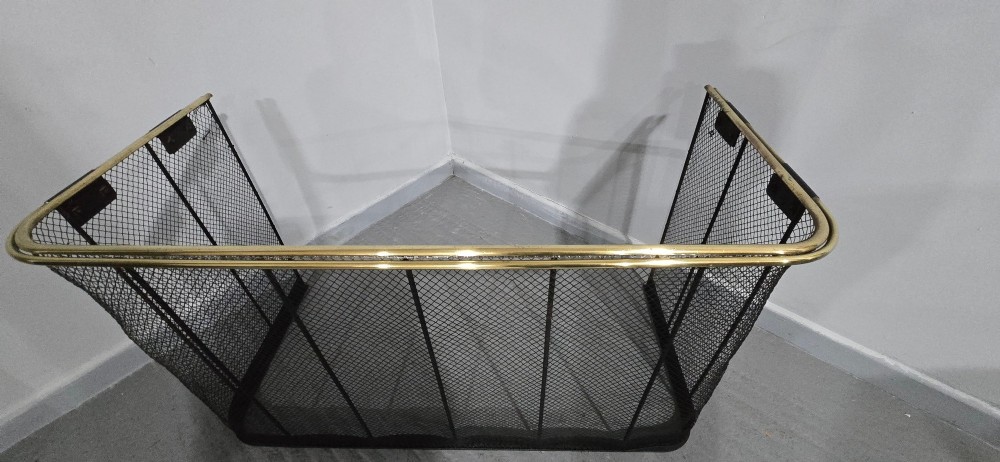 An early Victorian three-sided nursery fire guard featuring black woven wire mesh, vertical reinforcing bars, and a polished brass top rail. View VII