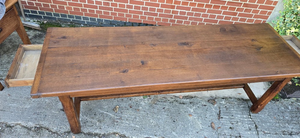 A long solid French oak refectory dining table featuring a plank top and straight legs connected by a low stretcher. View VII