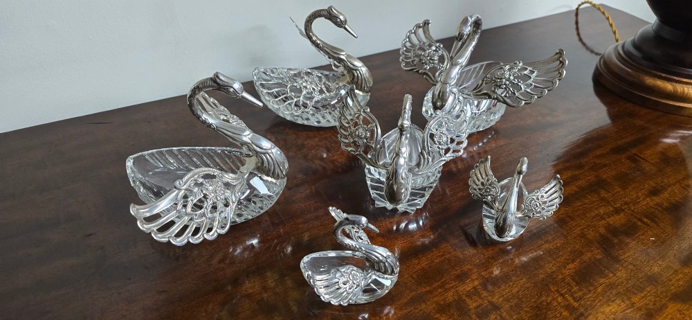 A group of cut glass open salt cellars shaped like swans with silver heads and detailed pierced silver wings. View XI