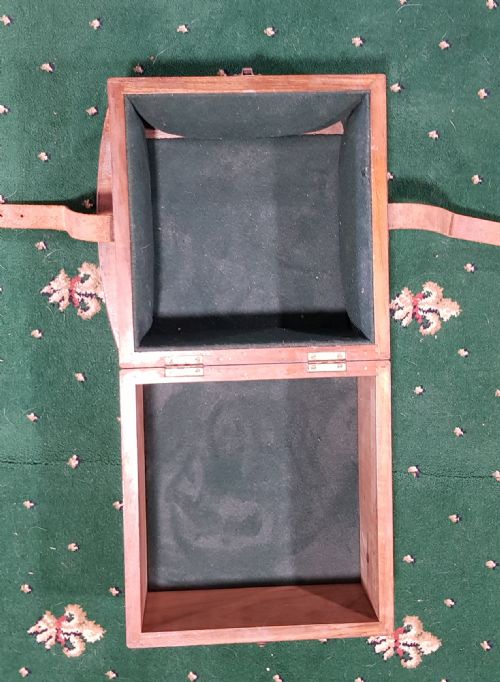 fig 1. A Thomas Mercer brass marine chronometer set within a fitted open mahogany box displaying a silvered dial with Roman numerals.
