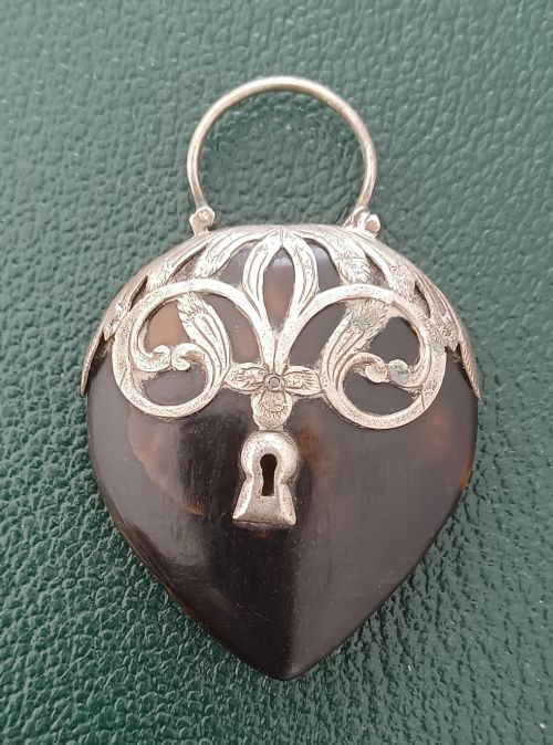 A VICTORIAN HEART SHAPED TORTOISESHELL AND SILVER MOUNTED PENDANT