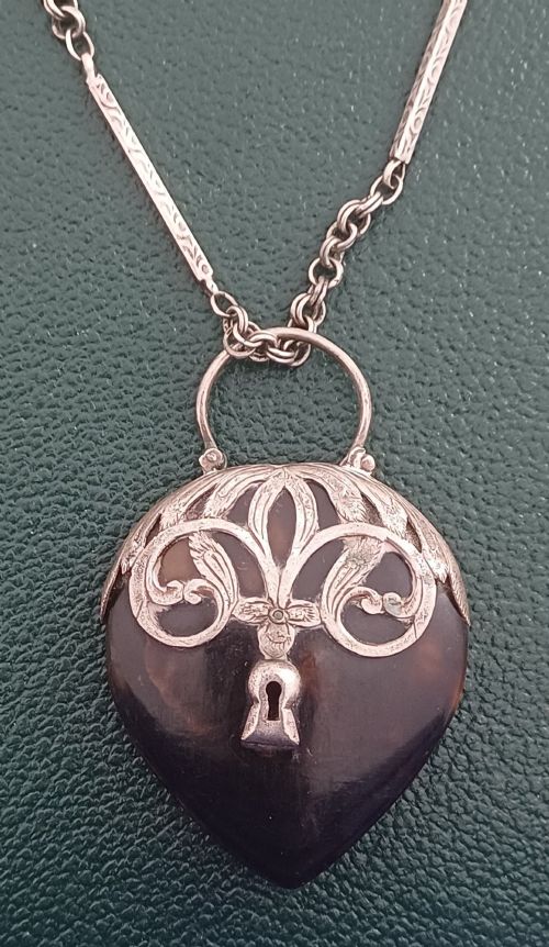 A VICTORIAN HEART SHAPED TORTOISESHELL AND SILVER MOUNTED PENDANT - ADDITIONAL PHOTO 1