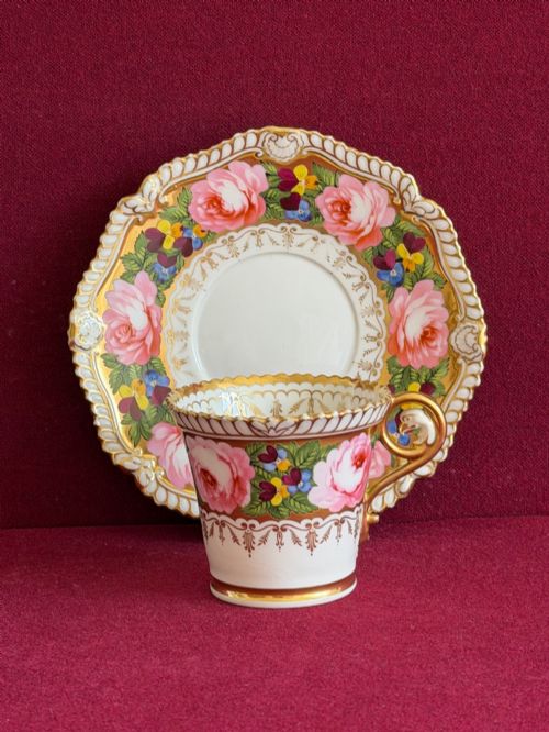 fig 1. An antique Regency Chamberlain Worcester porcelain trio featuring hand-painted pink roses, pansies, rich gilded borders, and eagle-head handle terminals.