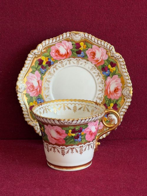 fig 2. An antique Regency Chamberlain Worcester porcelain trio featuring hand-painted pink roses, pansies, rich gilded borders, and eagle-head handle terminals.