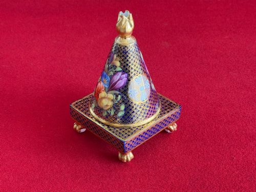 fig 2. A conical Regency Spode porcelain pastille burner featuring cobalt blue scale gilding, hand-painted floral panels, and gilt paw feet on a square pedestal base.