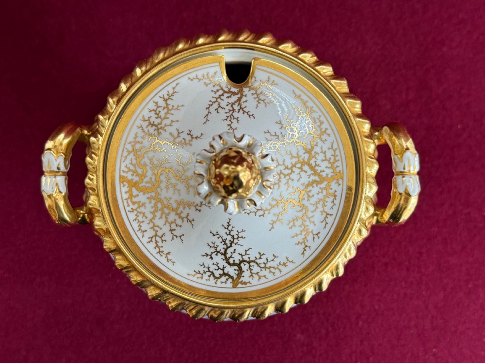 A pair of Regency Flight, Barr & Barr Worcester porcelain cream tureens featuring hand-painted bird panels, gilt seaweed pattern ornamentation, twin handles, and square plinth bases. View XIII