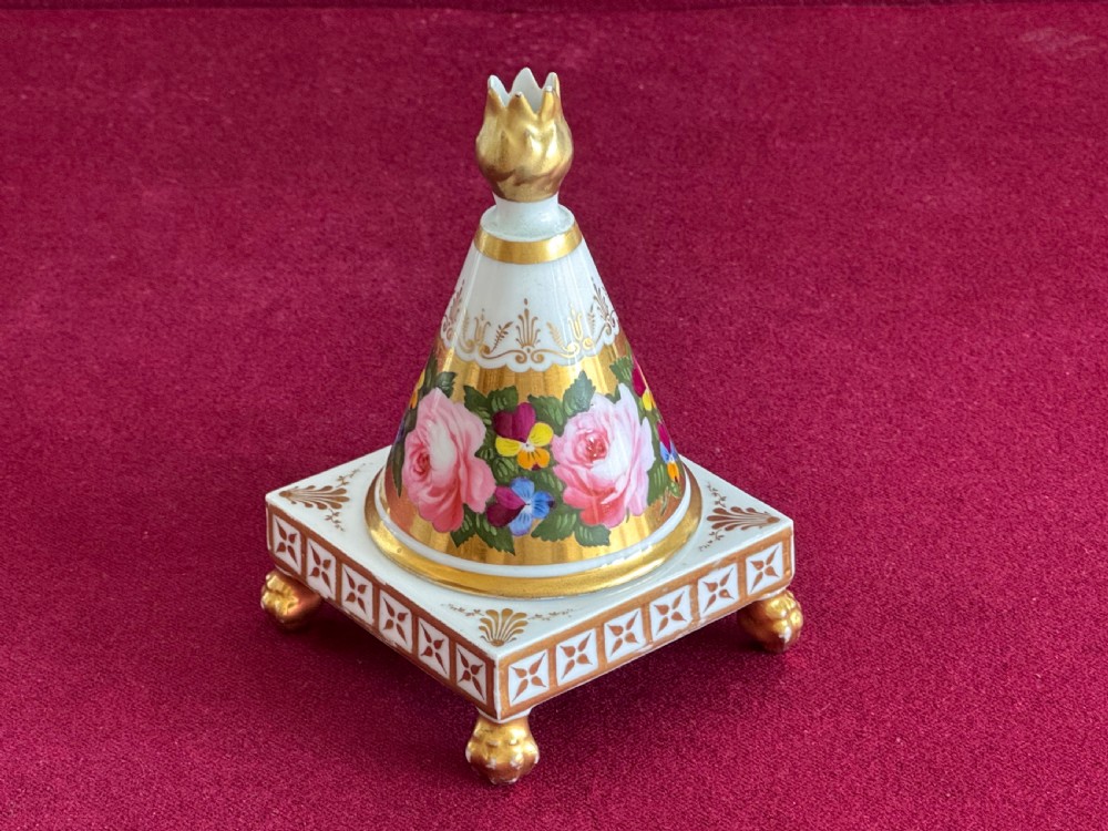 A conical Regency porcelain pastille burner decorated with hand-painted pink roses and pansies on a square gilded pedestal with claw feet. View III