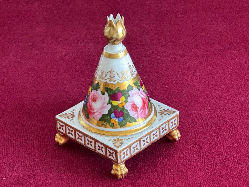 A conical Regency porcelain pastille burner decorated with hand-painted pink roses and pansies on a square gilded pedestal with claw feet. View IV