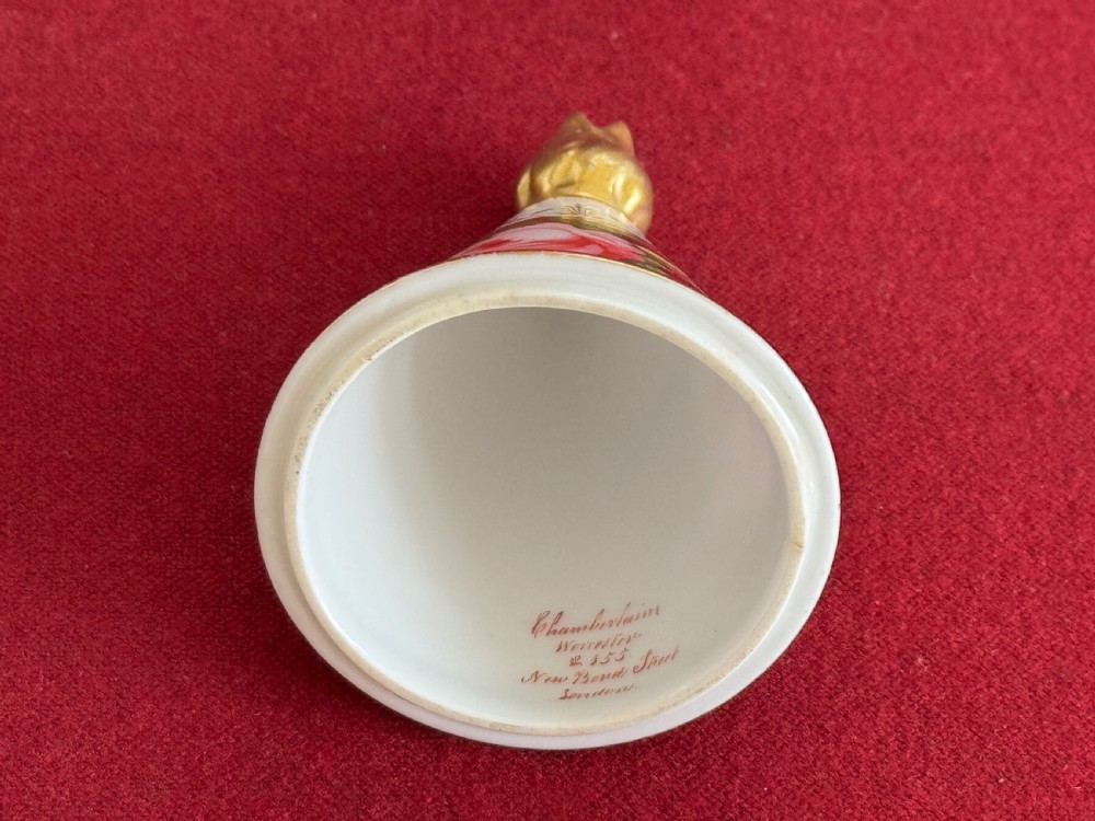 A conical Regency porcelain pastille burner decorated with hand-painted pink roses and pansies on a square gilded pedestal with claw feet. View V