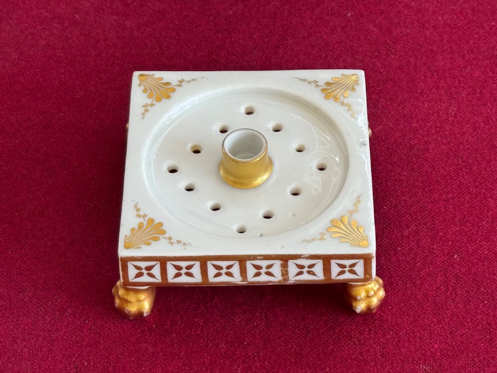 A conical Regency porcelain pastille burner decorated with hand-painted pink roses and pansies on a square gilded pedestal with claw feet. View VI