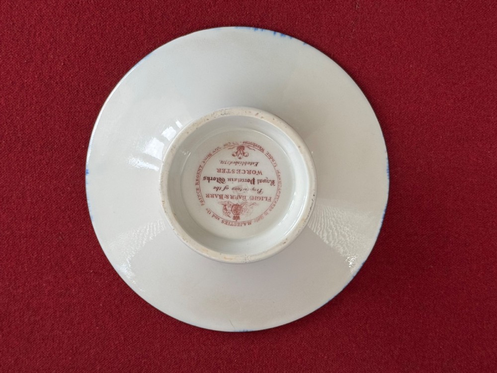 A Flight, Barr and Barr Worcester porcelain cup and saucer featuring cobalt blue ground, gilt palmette borders, and the Prince of Wales crest. View V