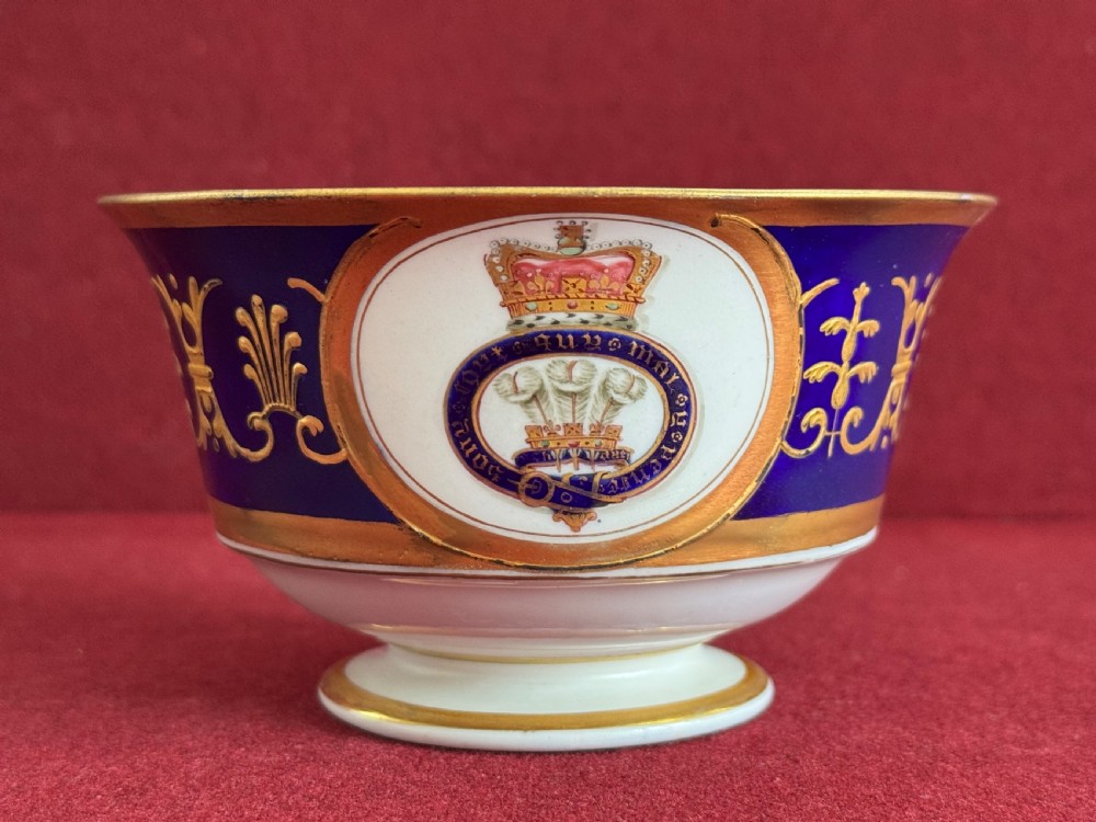 A Flight, Barr and Barr Worcester porcelain cup and saucer featuring cobalt blue ground, gilt palmette borders, and the Prince of Wales crest. View VI