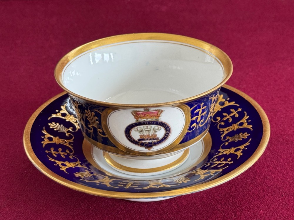 A Flight, Barr and Barr Worcester porcelain cup and saucer featuring cobalt blue ground, gilt palmette borders, and the Prince of Wales crest. View X