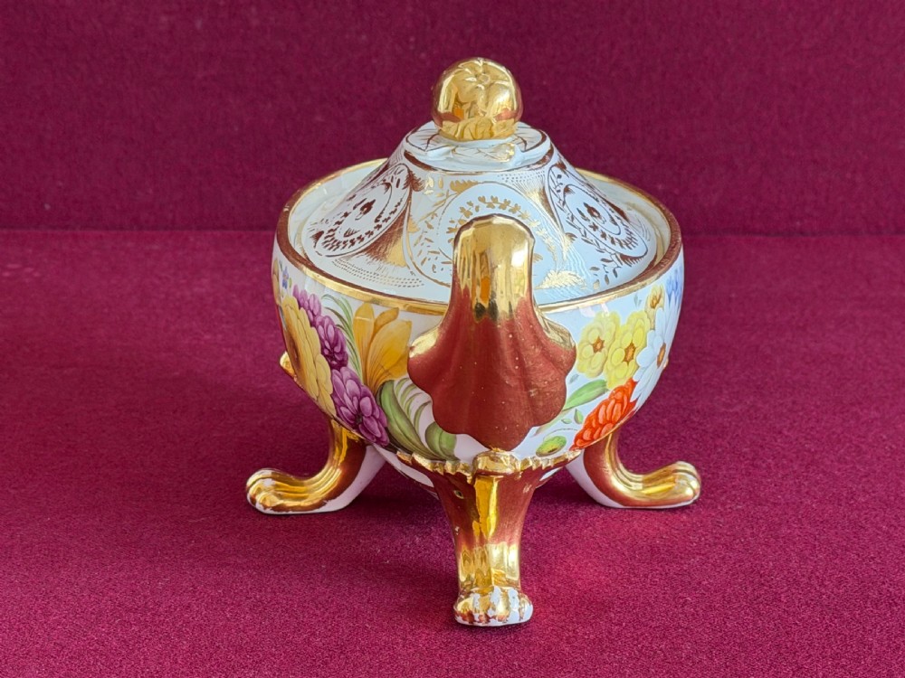 A Regency John Rose Coalport porcelain sauce tureen decorated with hand-painted flowers, gilded scroll handles, and a matching lid. View II