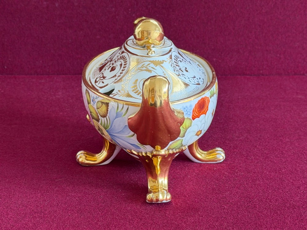 A Regency John Rose Coalport porcelain sauce tureen decorated with hand-painted flowers, gilded scroll handles, and a matching lid. View IV