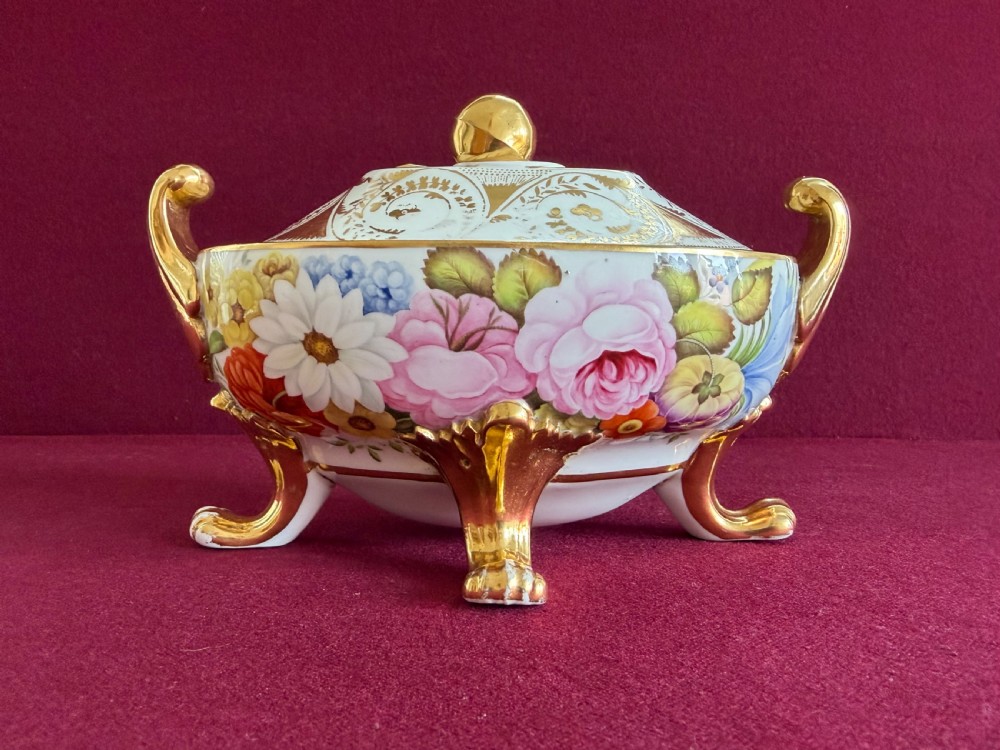 A Regency John Rose Coalport porcelain sauce tureen decorated with hand-painted flowers, gilded scroll handles, and a matching lid. View VIII
