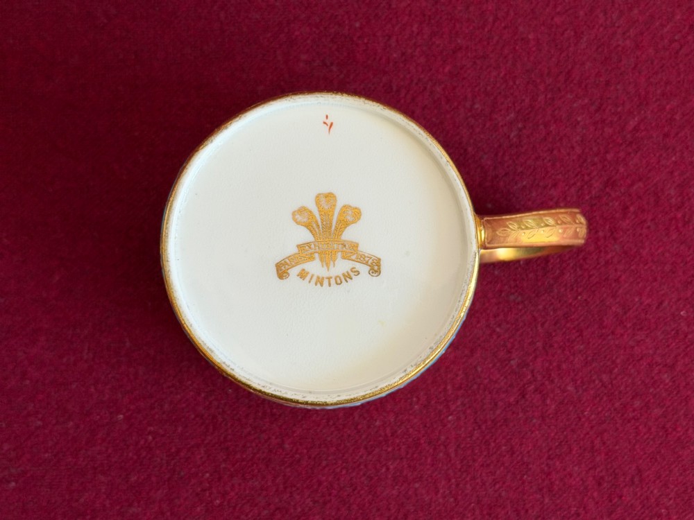 A Victorian Minton porcelain coffee can and saucer decorated with rich turquoise enamel, Neoclassical motifs, classical figure cameos, and gold leaf gilding. View VII