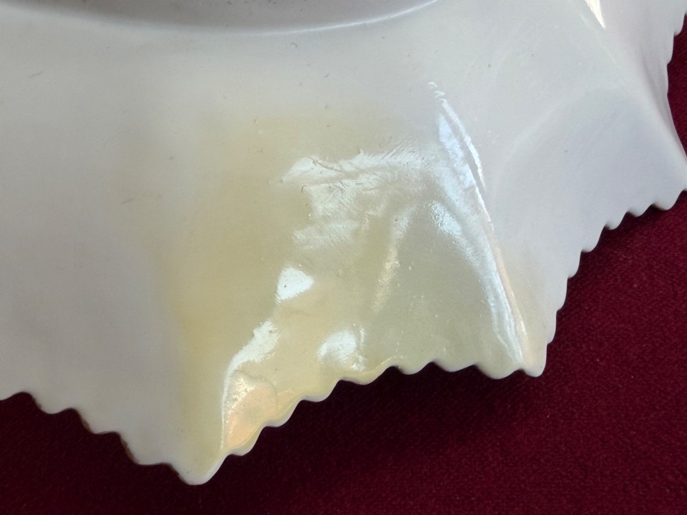 An apple green lobed porcelain basket with a gold overhead handle, gadrooned gilded border, and hand-painted central vignette of a classical figure and butterflies. View VII