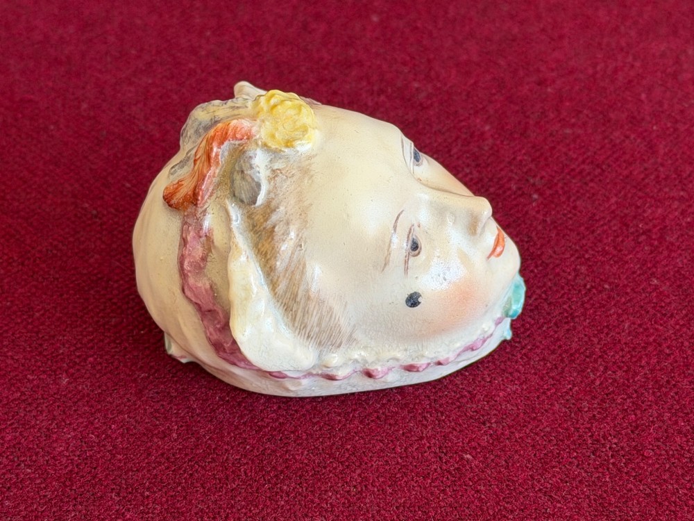 An 18th-century Chelsea soft-paste porcelain bonbonniere sculpted as a female head wearing a bonnet with polychrome enamel finish. View IV