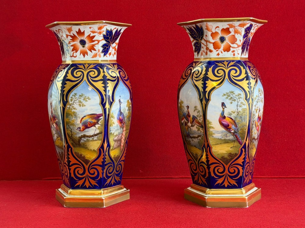 A pair of Regency period Flight, Barr & Barr Worcester porcelain vases featuring cobalt blue ground, heavy gold scrollwork, and painted exotic bird reserves. View II
