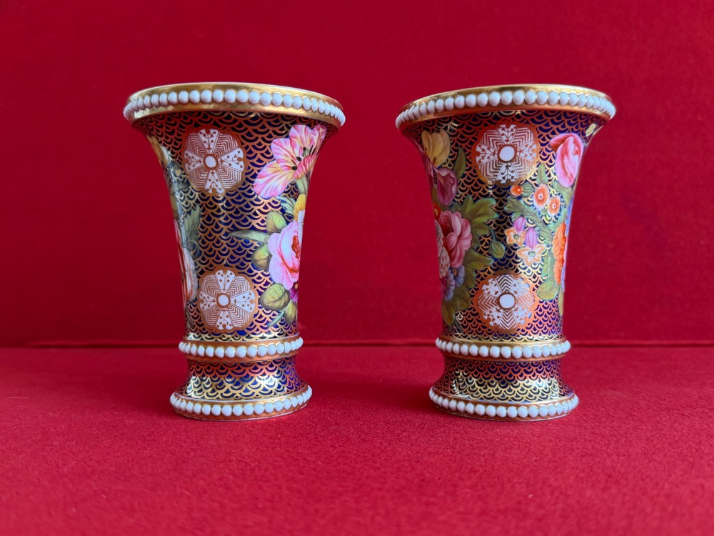 A pair of flared Regency Spode porcelain spill vases decorated with dark blue gilded fishscale patterns, colourful hand-painted floral panels, and white beaded borders. View III