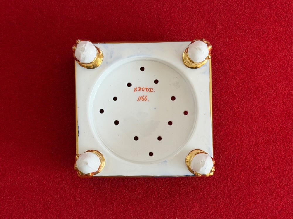 A conical Regency Spode porcelain pastille burner featuring cobalt blue scale gilding, hand-painted floral panels, and gilt paw feet on a square pedestal base. View II