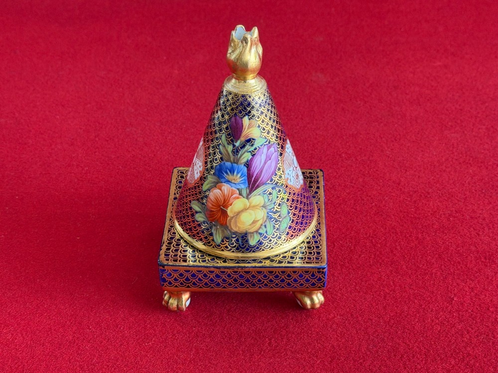 A conical Regency Spode porcelain pastille burner featuring cobalt blue scale gilding, hand-painted floral panels, and gilt paw feet on a square pedestal base. View IV