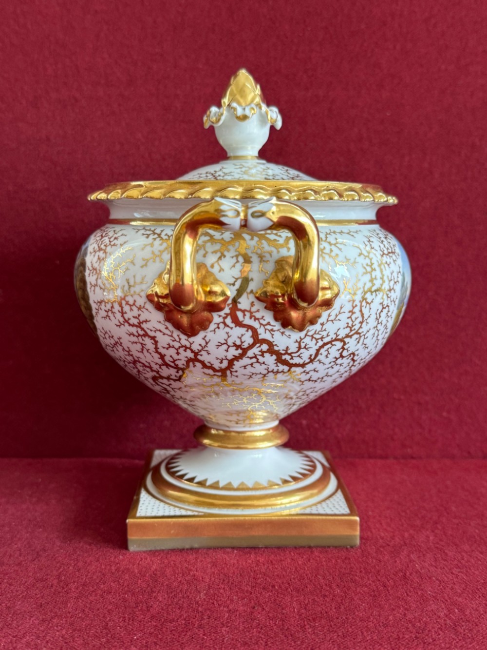 A pair of Regency Flight, Barr & Barr Worcester porcelain cream tureens featuring hand-painted exotic bird panels, elaborate gilding, twin scroll handles, and square plinth bases. View V