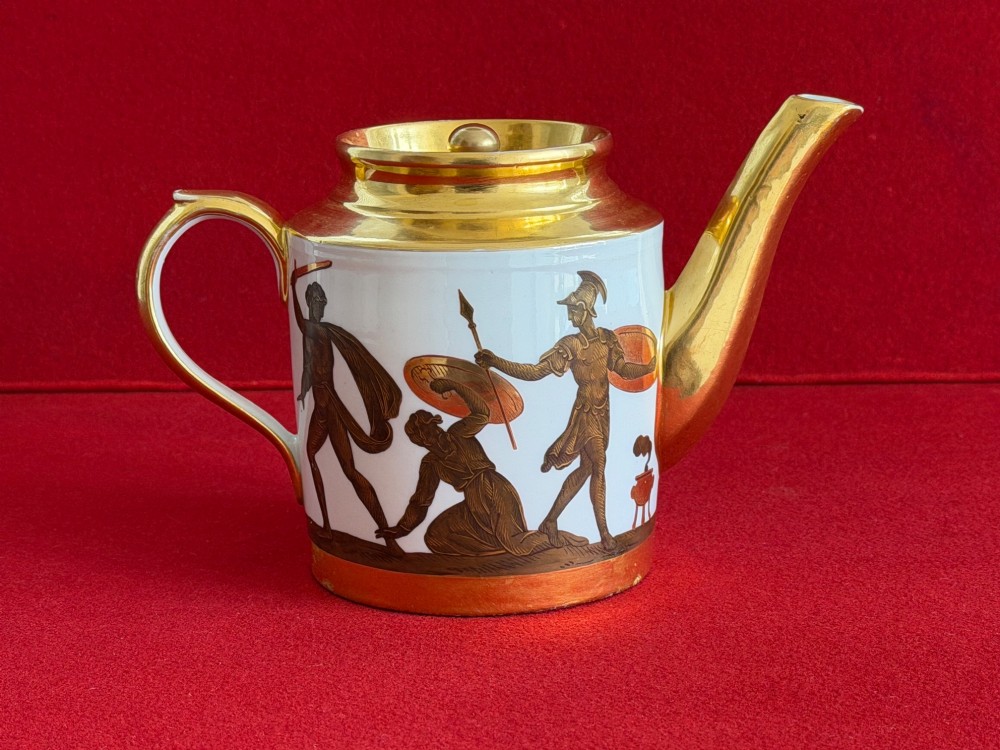 A Regency cylindrical porcelain teapot featuring a gilded spout and collar alongside hand-painted classical figures on a white ground. View IV