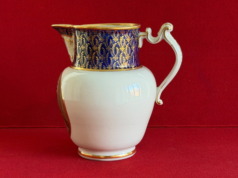 An eighteenth-century Flight and Barr Worcester porcelain jug decorated with a cobalt blue gilded collar and a sepia painted classical panel. View V