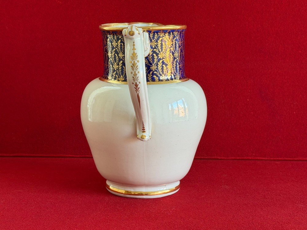 An eighteenth-century Flight and Barr Worcester porcelain jug decorated with a cobalt blue gilded collar and a sepia painted classical panel. View VI