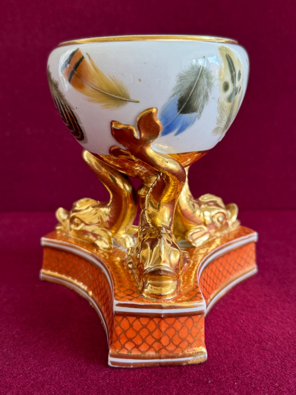A nineteenth-century Chamberlain Worcester porcelain pastille burner with hand-painted feathers on a white bowl supported by gilt dolphins. View VIII