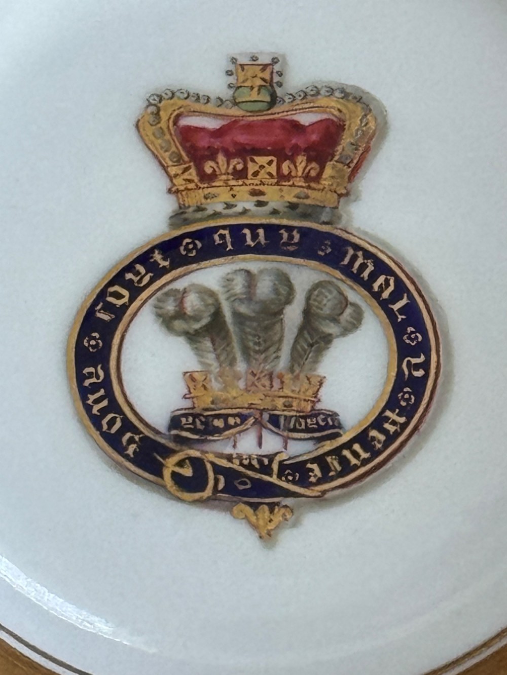 A Regency Flight, Barr and Barr Worcester porcelain cup and saucer featuring a deep cobalt blue border with intricate gold gilding and a central royal armorial crest. View IV