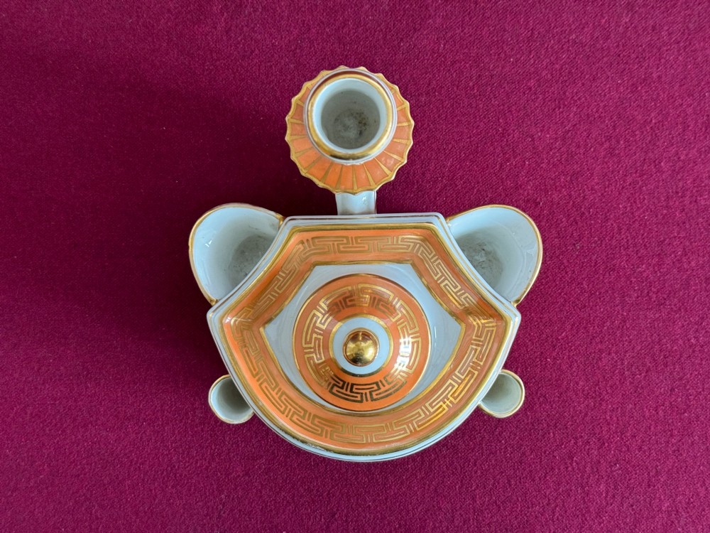 A Regency Flight & Barr Worcester porcelain inkstand painted with realistic seashell panels, gilded borders, quill holders, and a central candlestick. View V