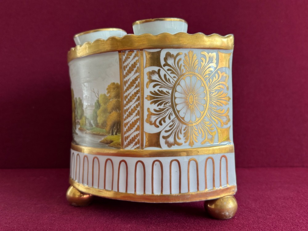 An antique Georgian porcelain bough pot decorated with a hand-painted landscape panel, gilded geometric scroll patterns, arch motifs, and gilt ball feet. View III