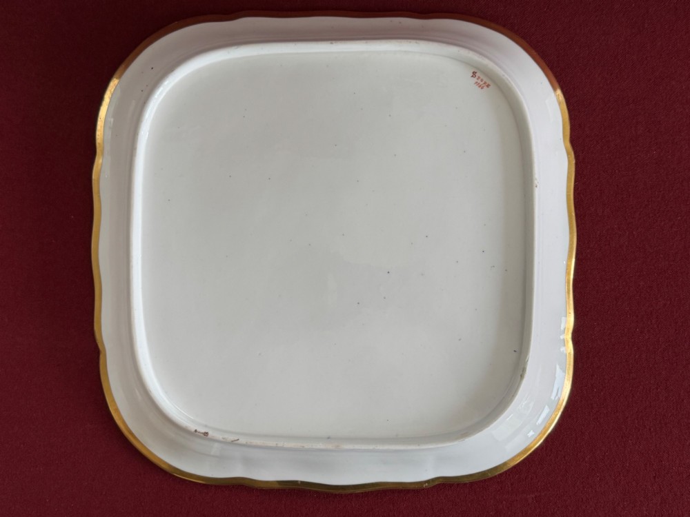 A square Regency porcelain tray featuring hand-painted floral bouquets, an intricate gilt scale pattern over a cobalt blue ground, and a central white reserve with pink roses. View IX