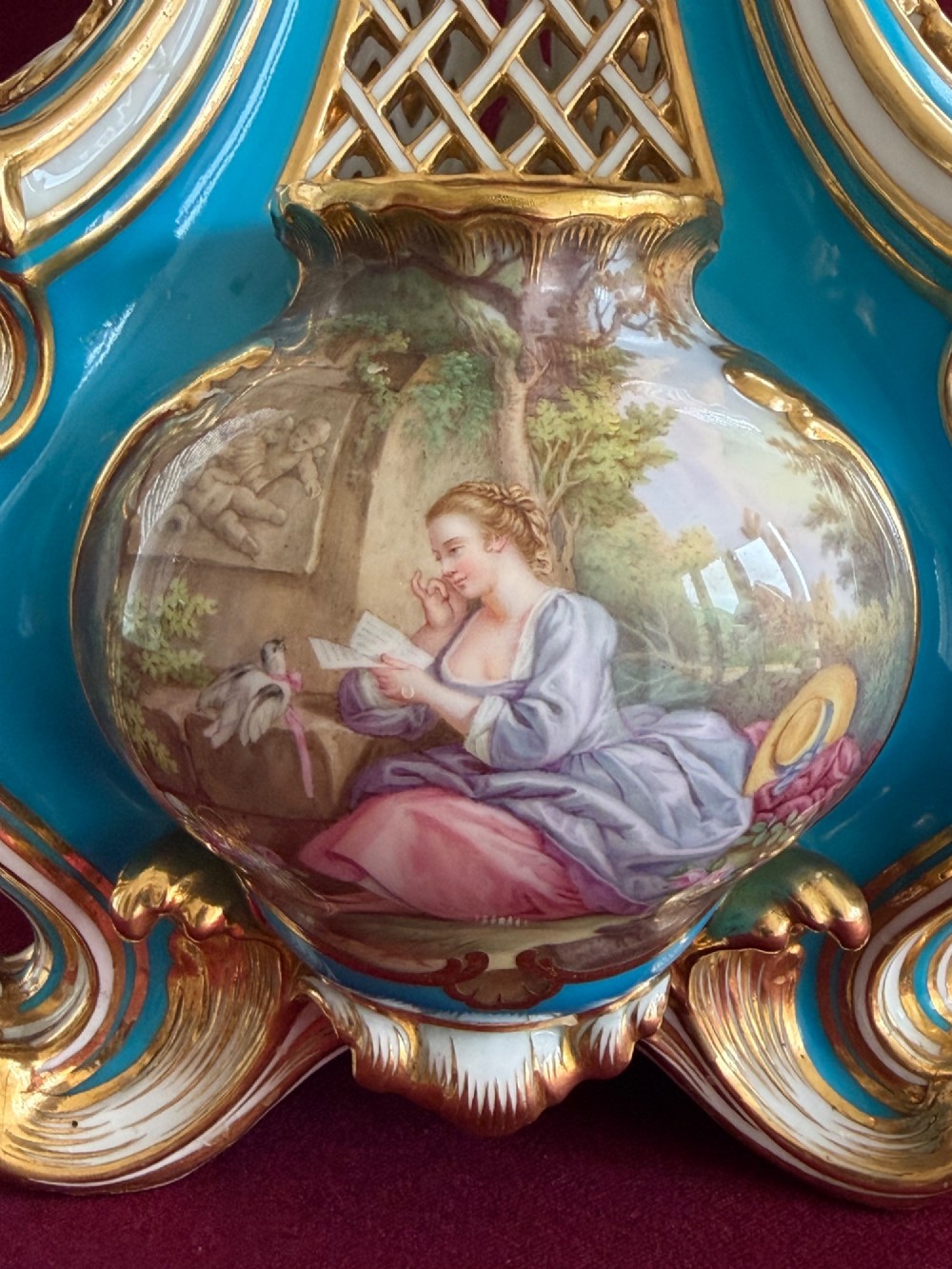 A Victorian Minton porcelain Sevres style vase featuring vibrant turquoise bleu celeste glaze, a reticulated lattice back, gilded Rococo scroll mouldings, and a hand-painted central pastoral scene. View VI