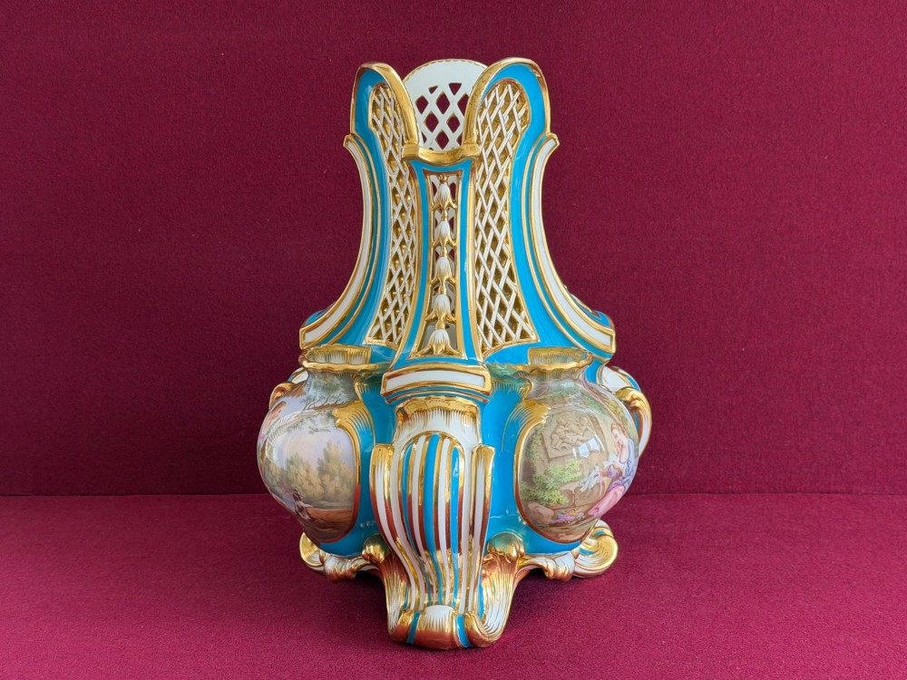 A Victorian Minton porcelain Sevres style vase featuring vibrant turquoise bleu celeste glaze, a reticulated lattice back, gilded Rococo scroll mouldings, and a hand-painted central pastoral scene. View XI