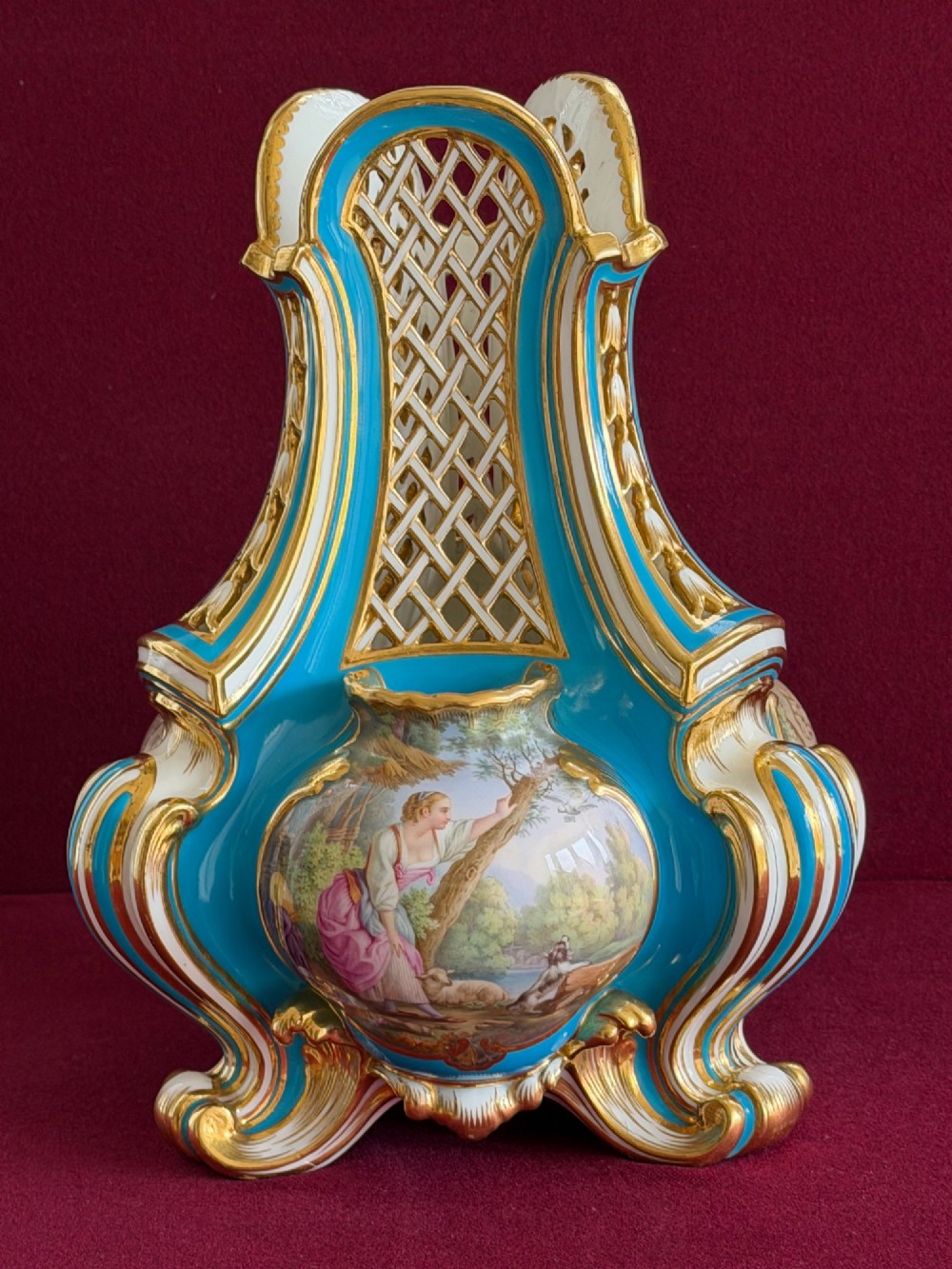 A Victorian Minton porcelain Sevres style vase featuring vibrant turquoise bleu celeste glaze, a reticulated lattice back, gilded Rococo scroll mouldings, and a hand-painted central pastoral scene. View XII