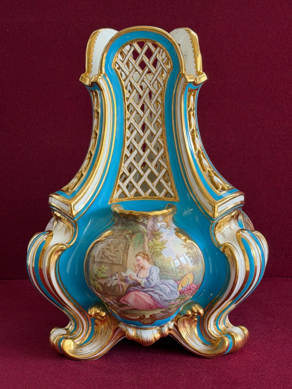 A Victorian Minton porcelain Sevres style vase featuring vibrant turquoise bleu celeste glaze, a reticulated lattice back, gilded Rococo scroll mouldings, and a hand-painted central pastoral scene. View XIII