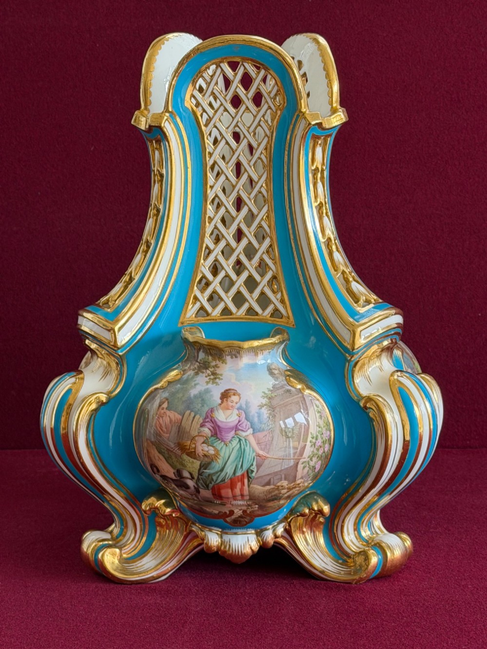 A Victorian Minton porcelain Sevres style vase featuring vibrant turquoise bleu celeste glaze, a reticulated lattice back, gilded Rococo scroll mouldings, and a hand-painted central pastoral scene. View XIV