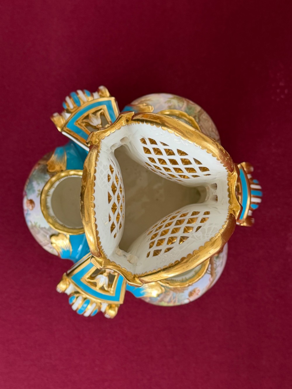 A Victorian Minton porcelain Sevres style vase featuring vibrant turquoise bleu celeste glaze, a reticulated lattice back, gilded Rococo scroll mouldings, and a hand-painted central pastoral scene. View XV