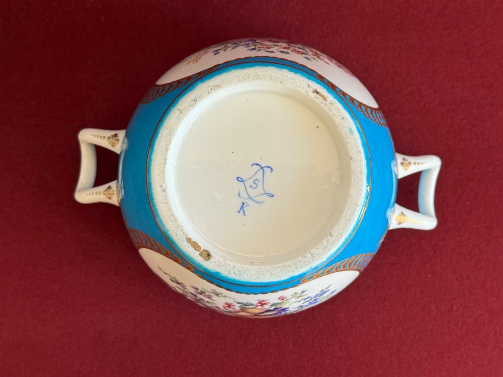 A pair of turquoise porcelain bottle coolers featuring hand-painted fruit cartouches framed by gilded scrollwork and twin handles. View IV