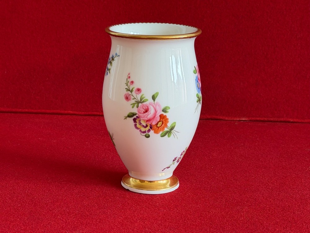 A white porcelain spill vase featuring hand-painted floral sprays, a flared lip, and gilded accent bands along the rim and base. View III