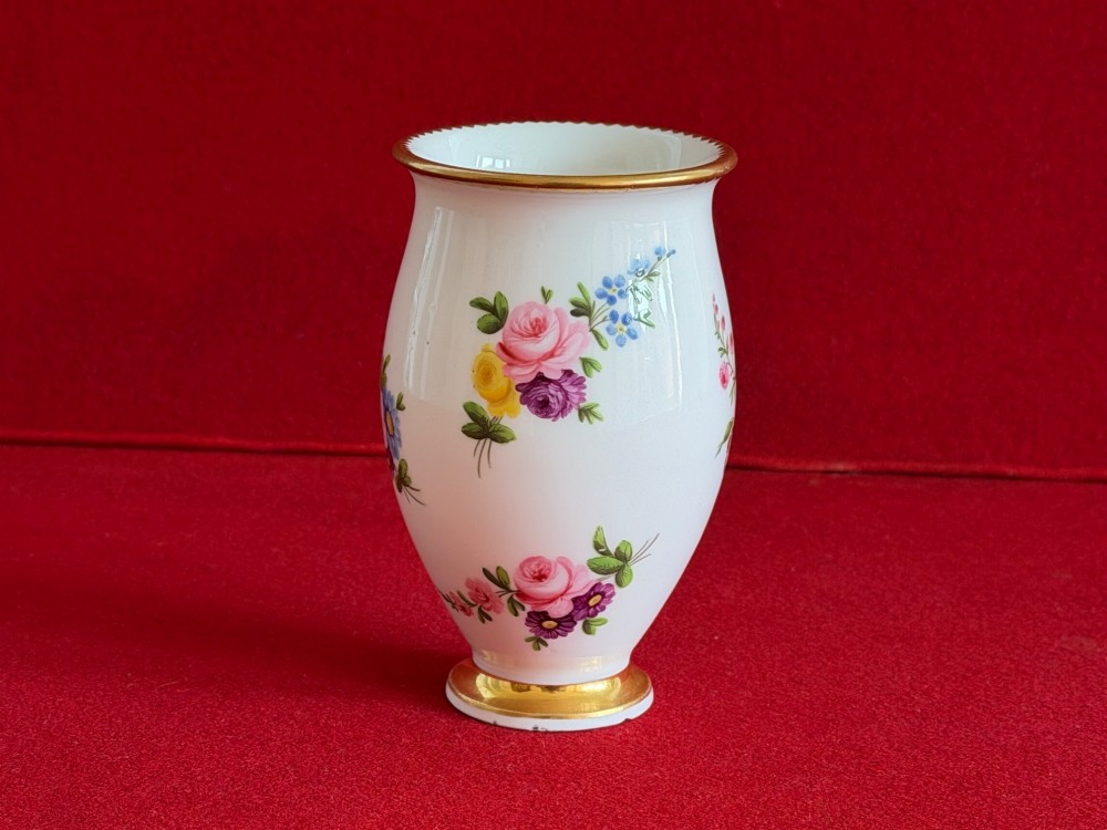 A white porcelain spill vase featuring hand-painted floral sprays, a flared lip, and gilded accent bands along the rim and base. View IV