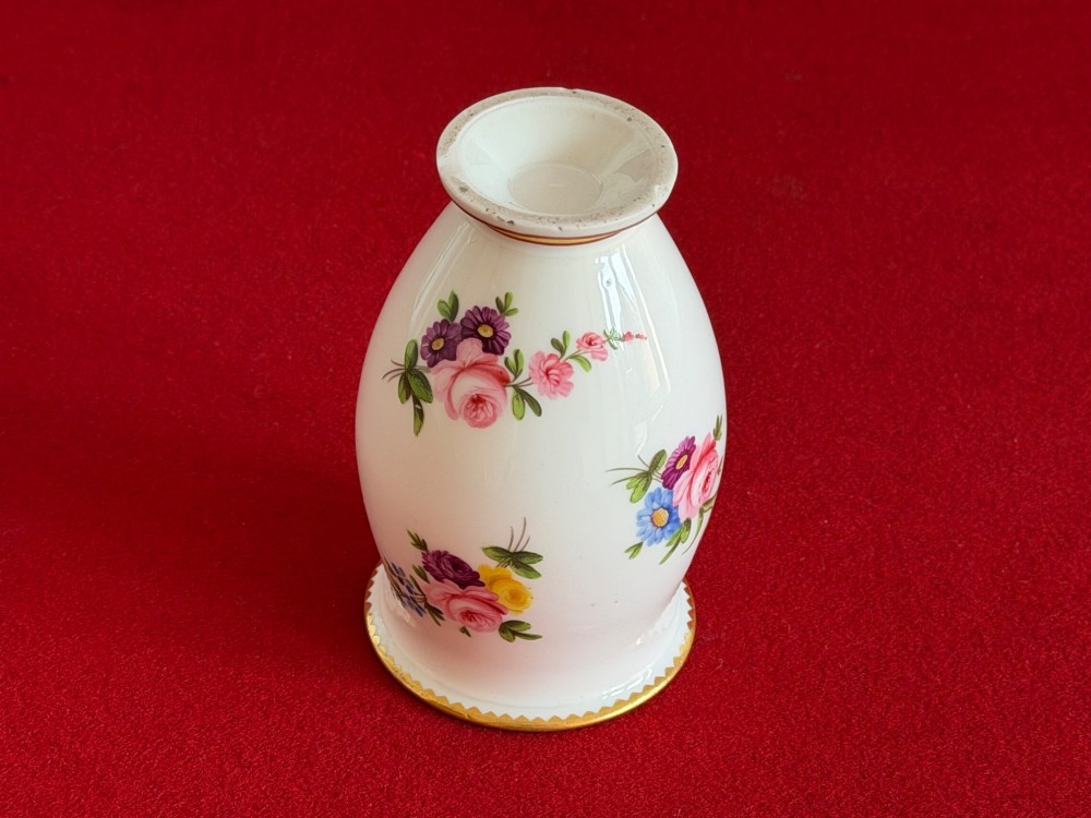 A white porcelain spill vase featuring hand-painted floral sprays, a flared lip, and gilded accent bands along the rim and base. View VI