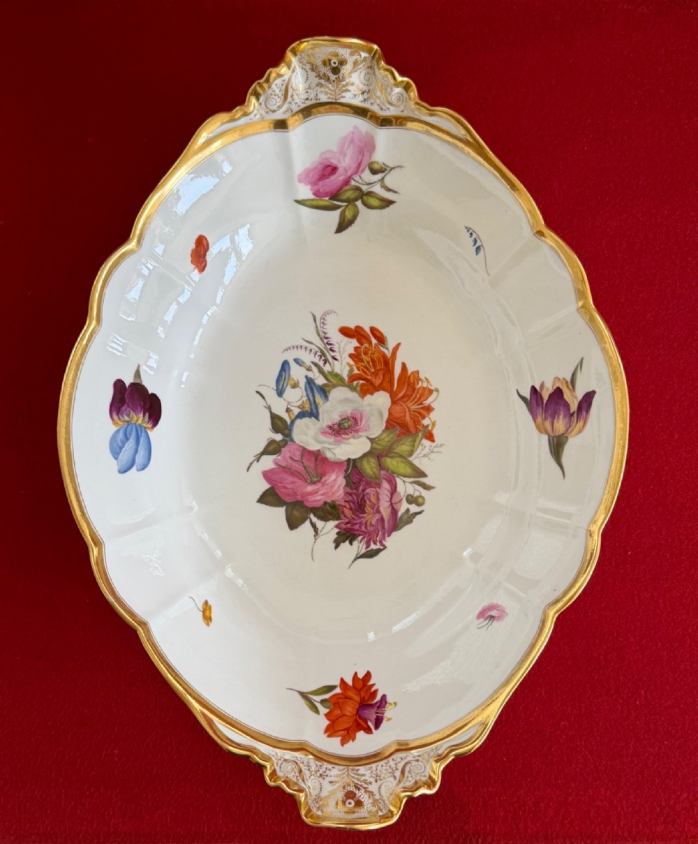An oval lobed white porcelain centrepiece dish with gilded handles and borders, featuring hand-painted botanical floral sprays. View II