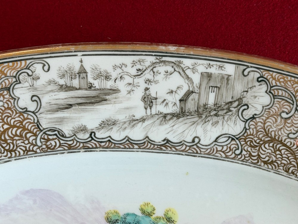 An oval Coalport porcelain meat platter decorated with hand-painted oriental figures in a landscape surrounded by a floral and gilded border. View III